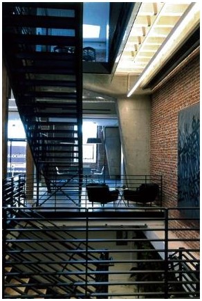After: a more open office plan allows views similar to original warehouse